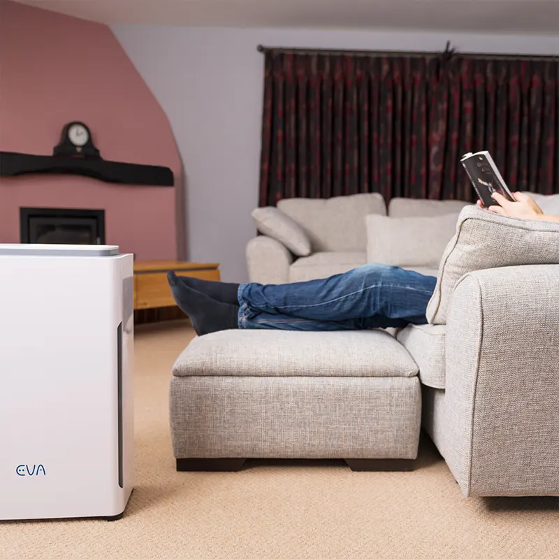 EVA Alto nine Air purifier with man on couch